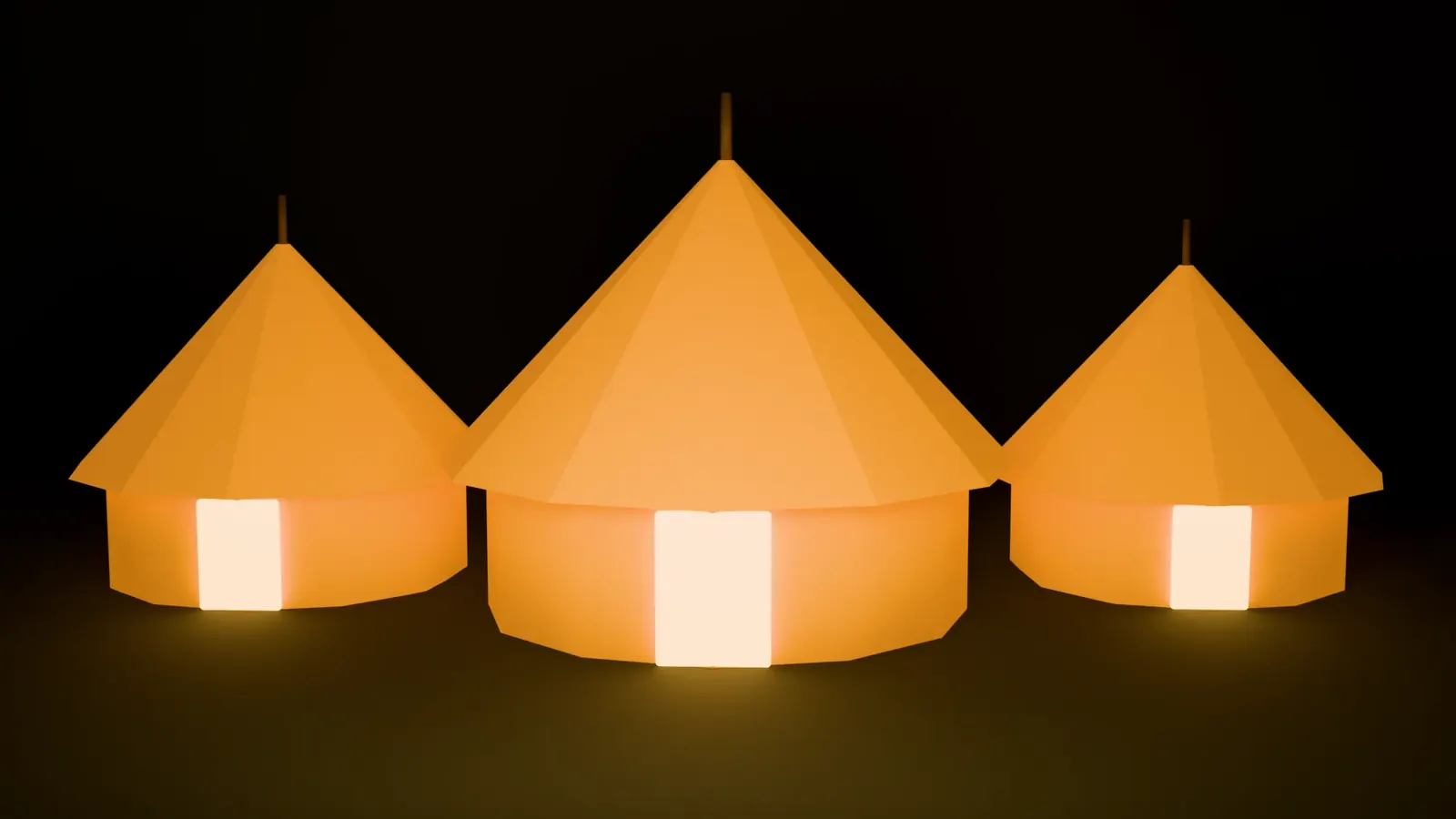 Three bell tents glowing in a row at night