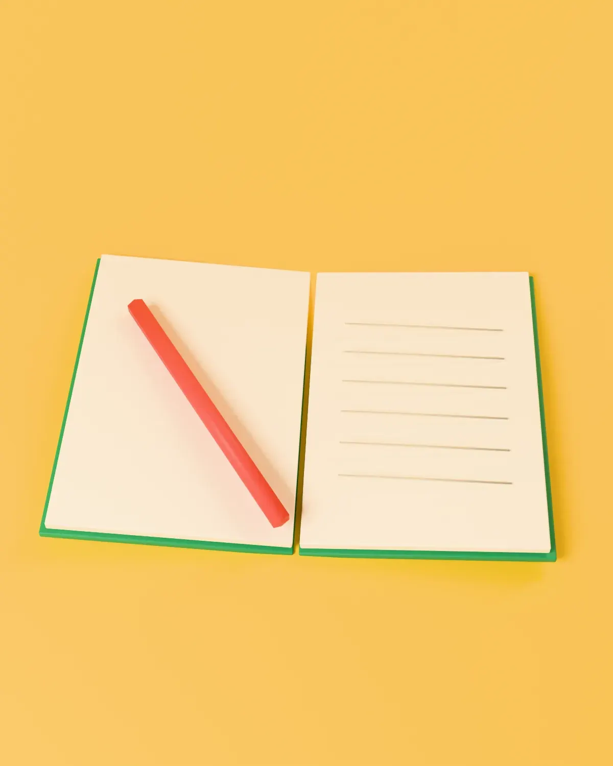 An open Fieldnote notebook with a red pencil, on yellow