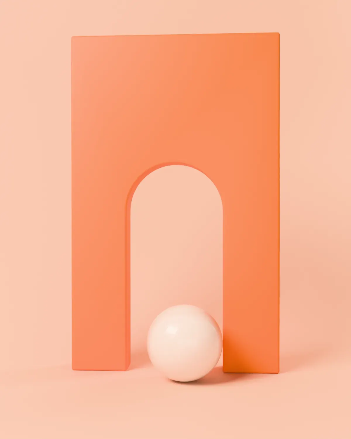 A single tall orange arch with a pale sphere passing through