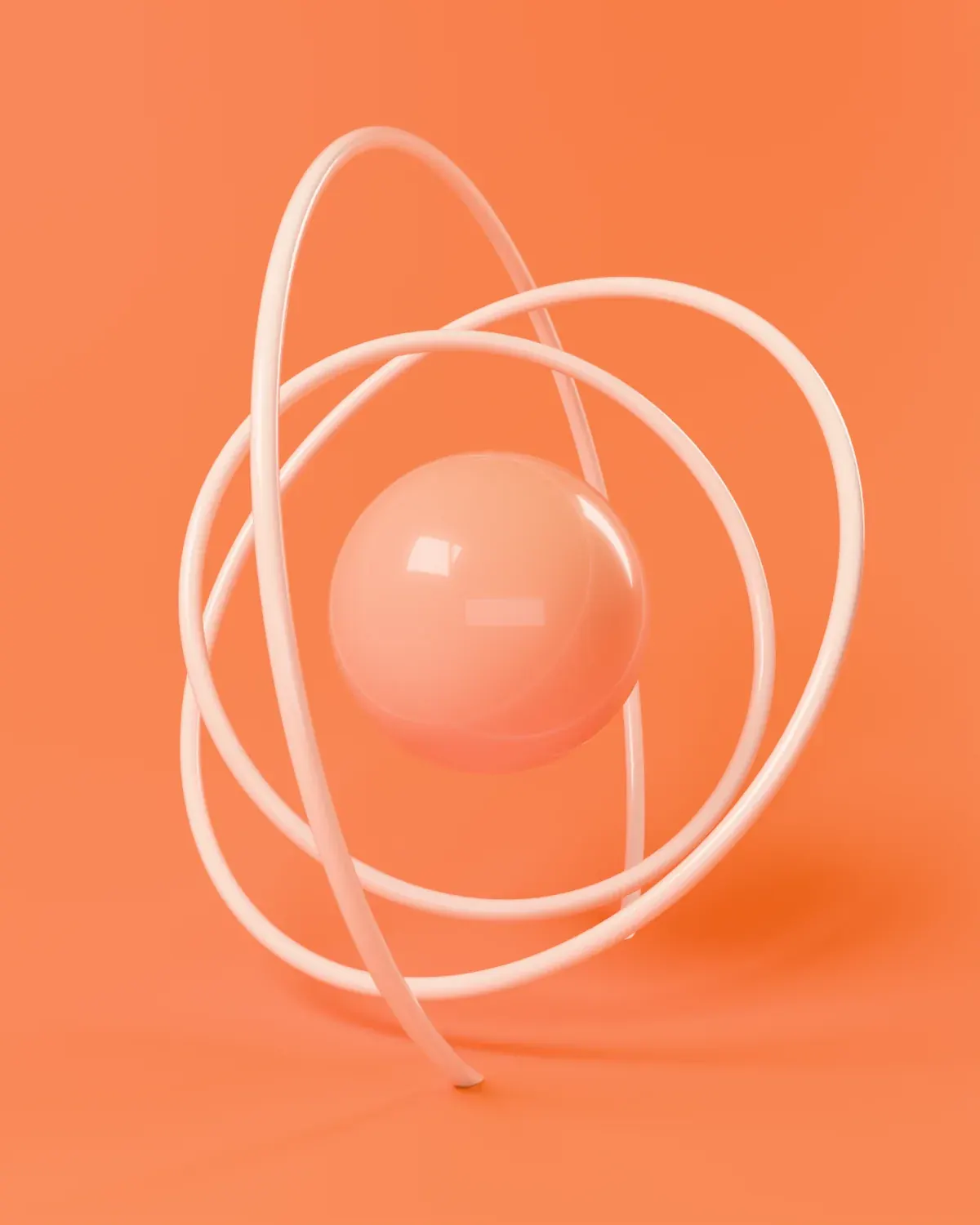 Pale rings orbiting a soft sphere on an orange set